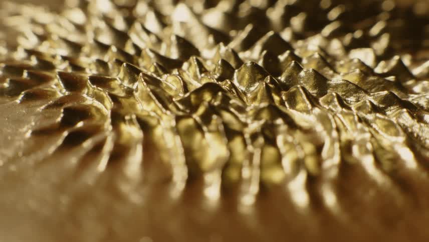Golden surface form peaks and ridges with vibration then subsides