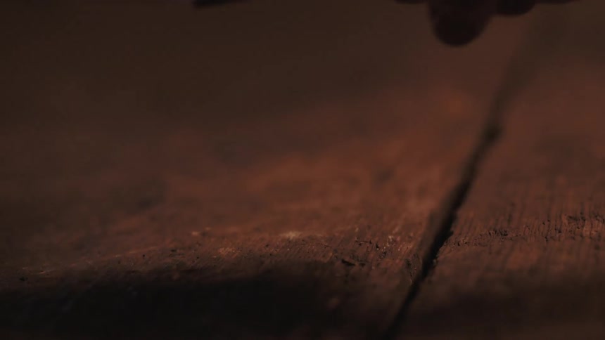 An axe is lifted from a table