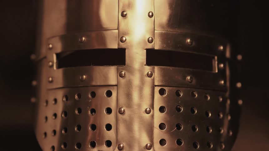 Light reflects off a metal helmet