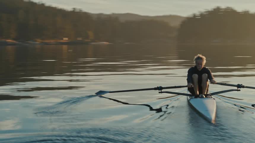 A man kayaks in a lake