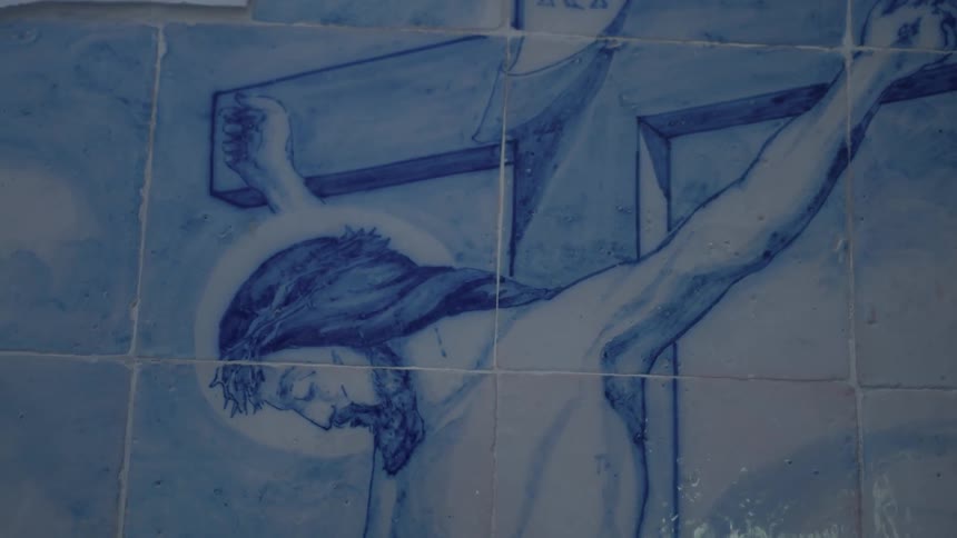 A religious painting is on this wall
