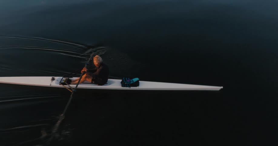 A man is rowing in the lake