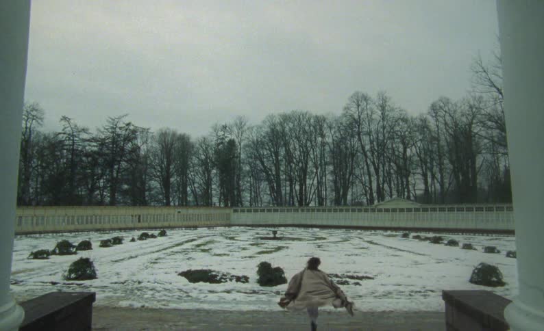 A woman runs from the house