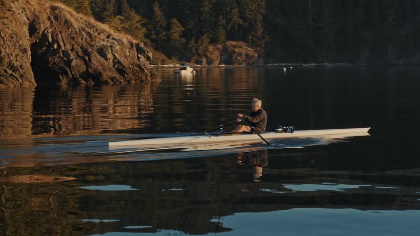 A man kayaks in a lake