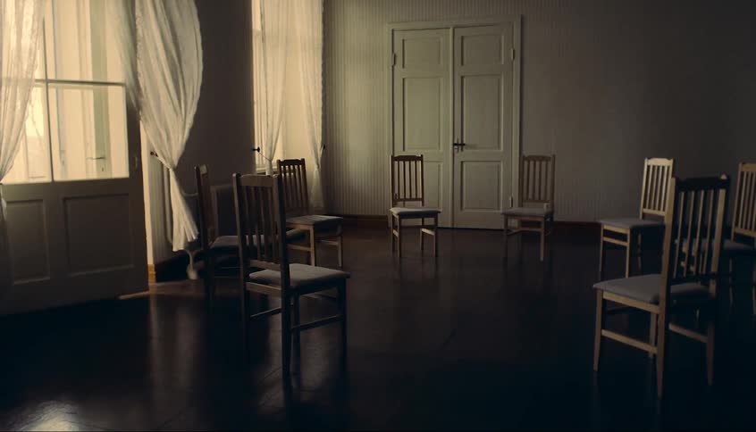 The room has a circle of chairs