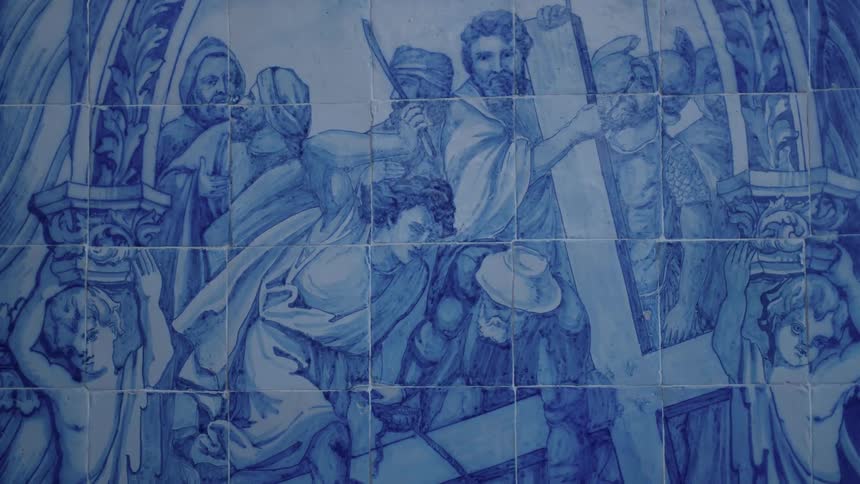 A wall has a religious painting on it