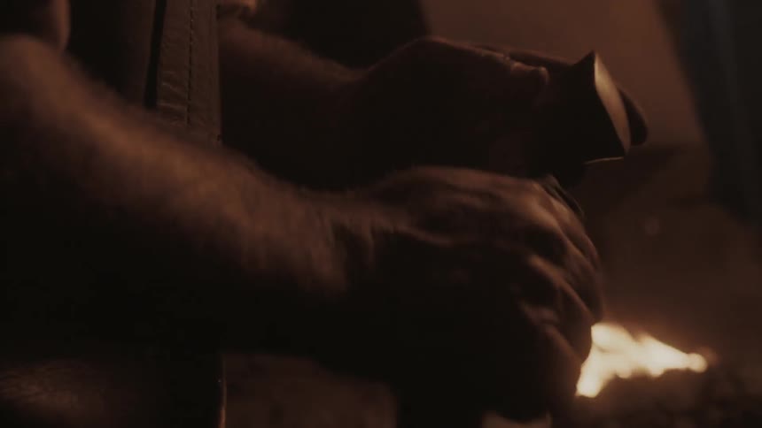 A man polishes his hammer