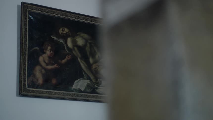 A painting is on a white wall