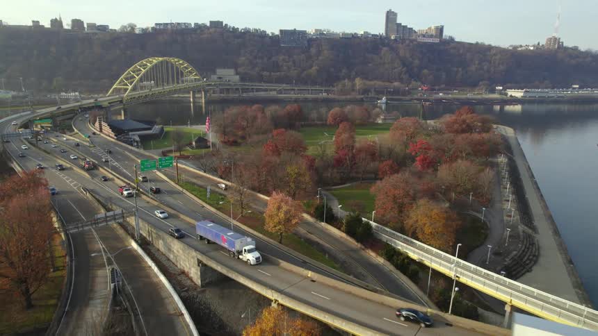 Aerial view of traffic on a highway is displayed