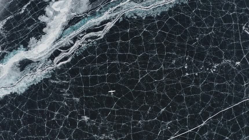 Topview of a plane on a frozen lake