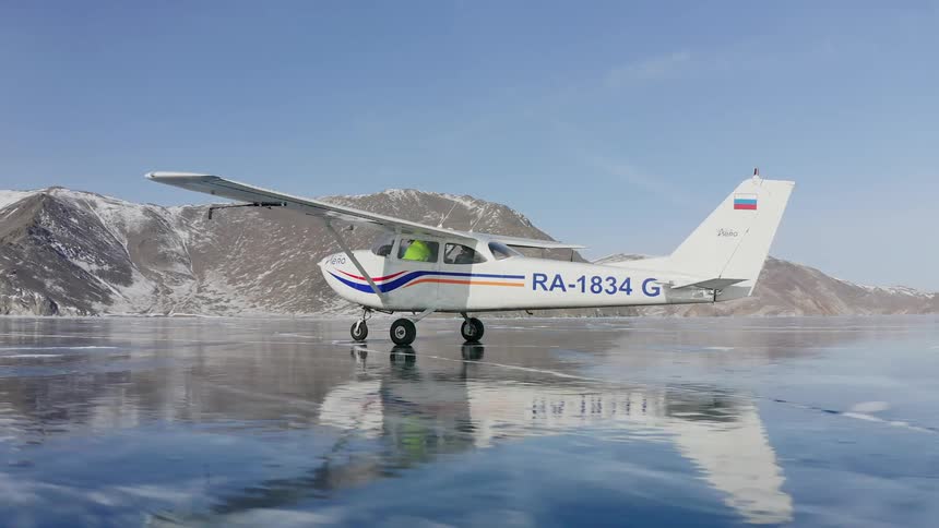 In the winter time the plane is flying around the nature area