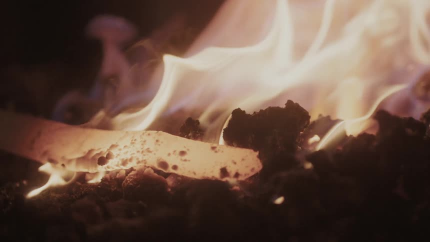 Metal is slowly melting in a fire
