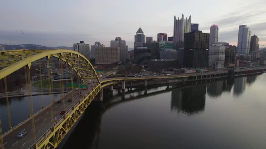 Aerial view of traffic on the fort pitt bridge over the monongahela river next to the pittsburgh skyline at morning