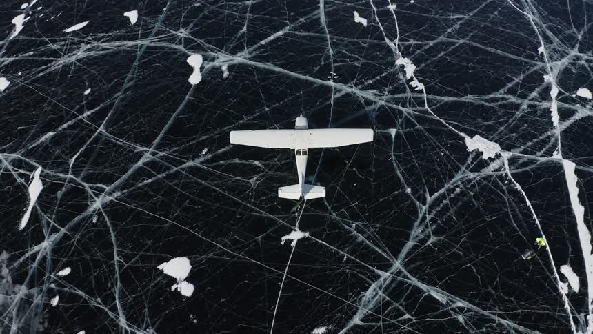 There is a plane that is flying around the artic area in the day time