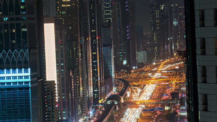 Aerial view of traffic in a timelapse is displayed
