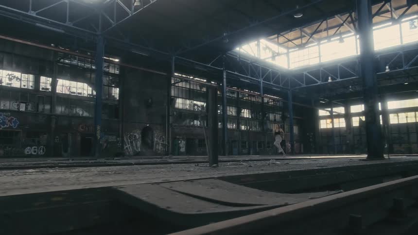 A woman running in an empty building
