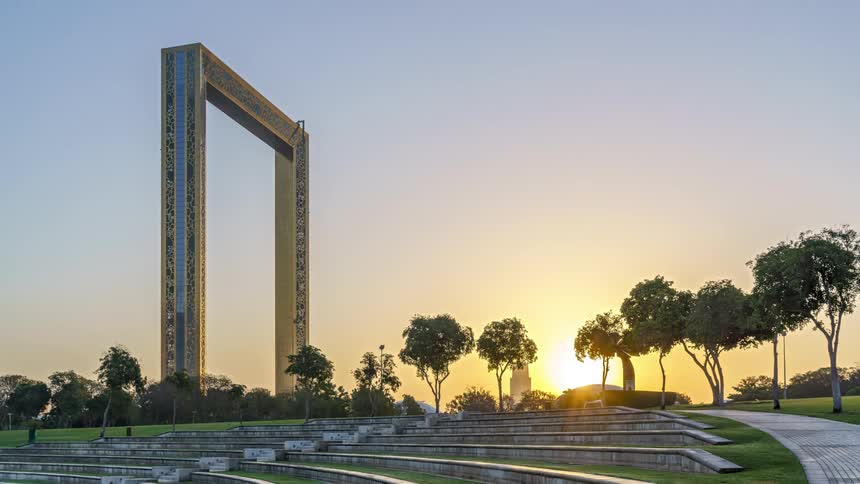 Light of building near park turn off as sun rises