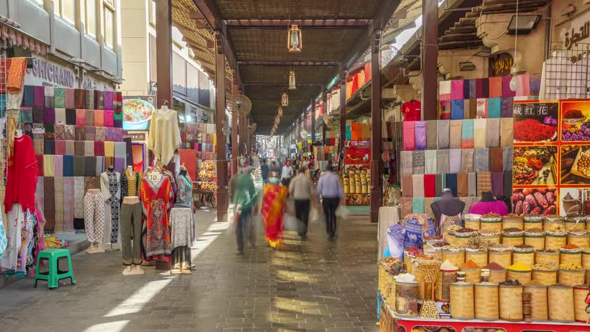 Time lapse of people walking through shops