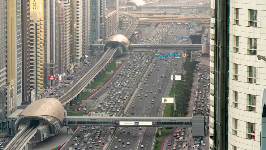 Time lapse view of traffic in a city is displayed