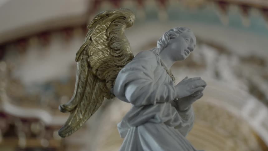 A statue of a man has wings