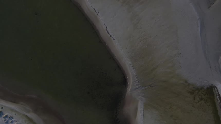 Islands below are surrounded by dark water