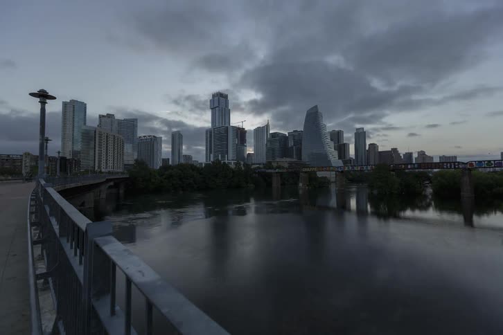 Time lapse view of a downtown city is displayed