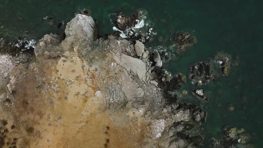 A birds eye view of a rocky shoreline