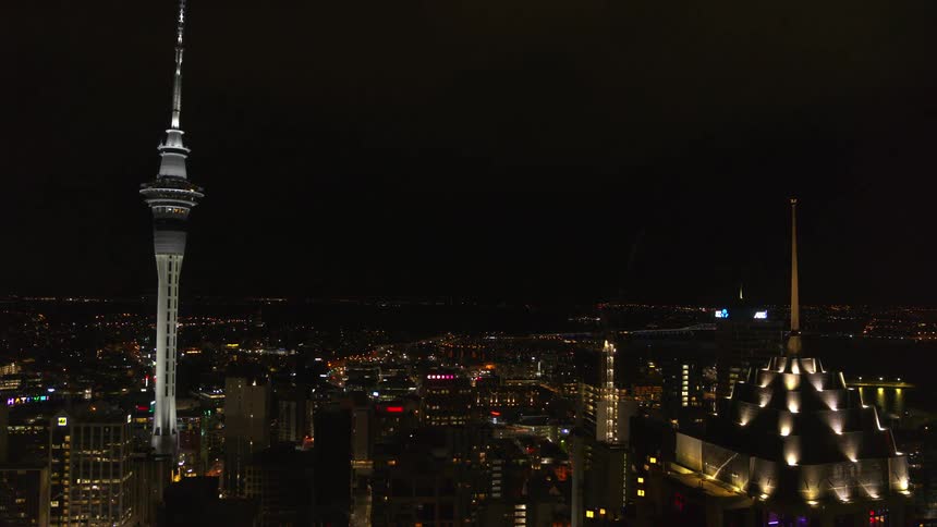 Aerial view of high rise office buildings and sky scrapers in a city at night