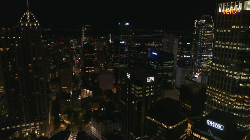 A bustling city is lit up at night