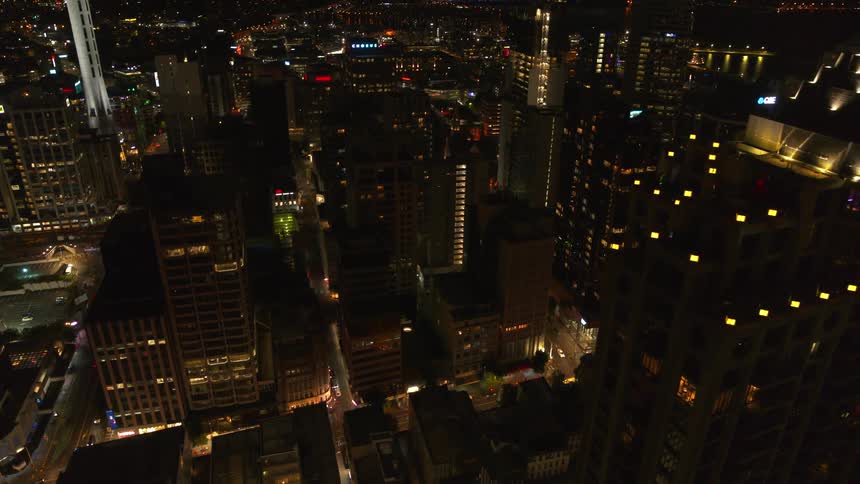 A city skyline is lit up at night