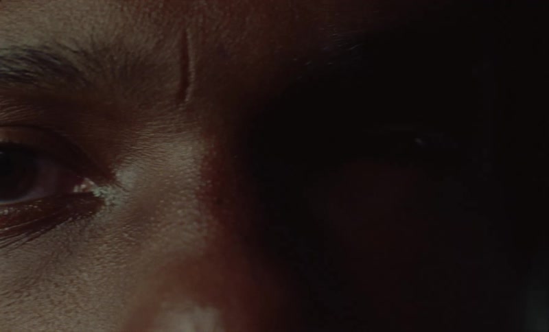 Close up view of a persons face is displayed on film