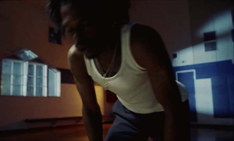 A man drops the basketball and rests