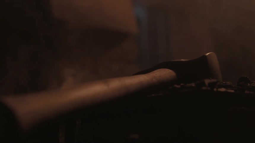 A hand puts down a hammer