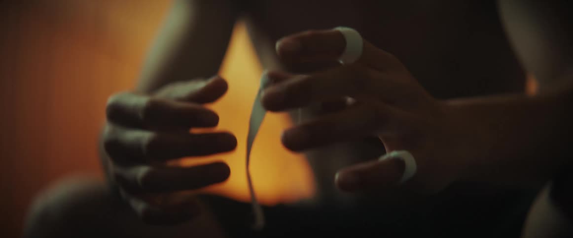 A view of a person wrapping fingers in tape