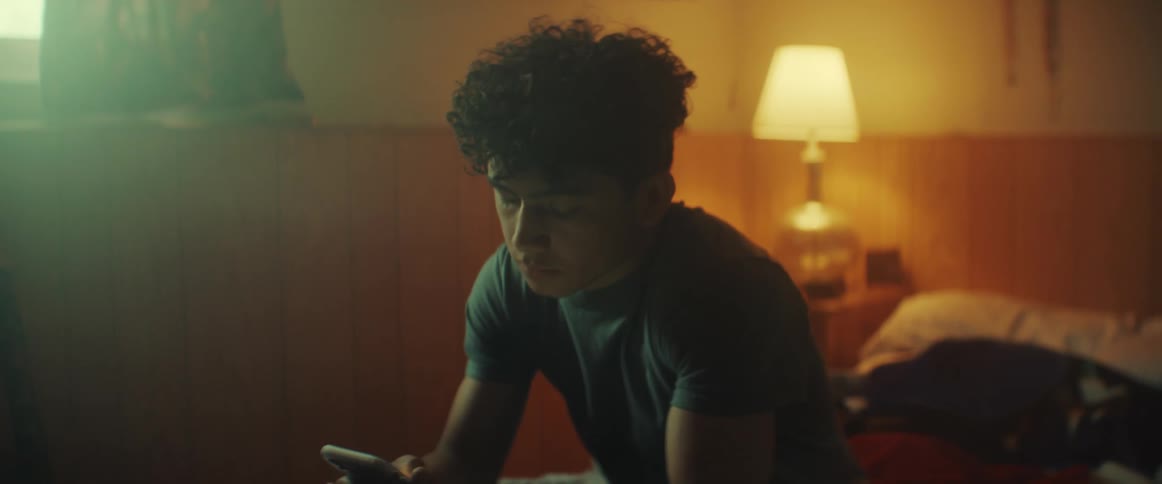 A person using a phone in a room