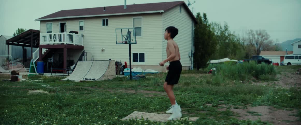 A child jumping rope outdoors