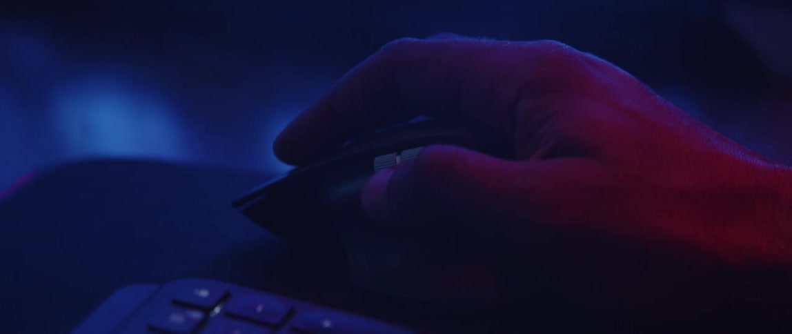 Person uses mouse as colored lighting changes shades