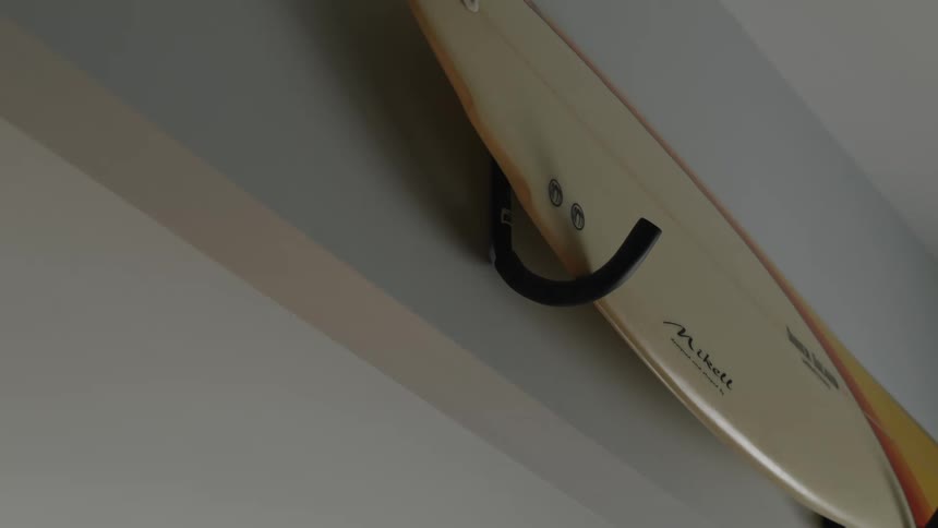 A surfboard is mounted on a wall
