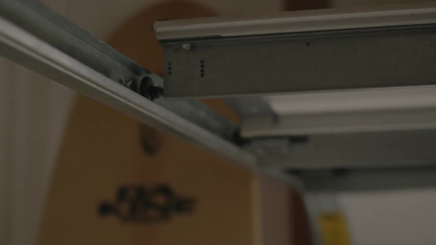 A garage door opening and sliding on its track
