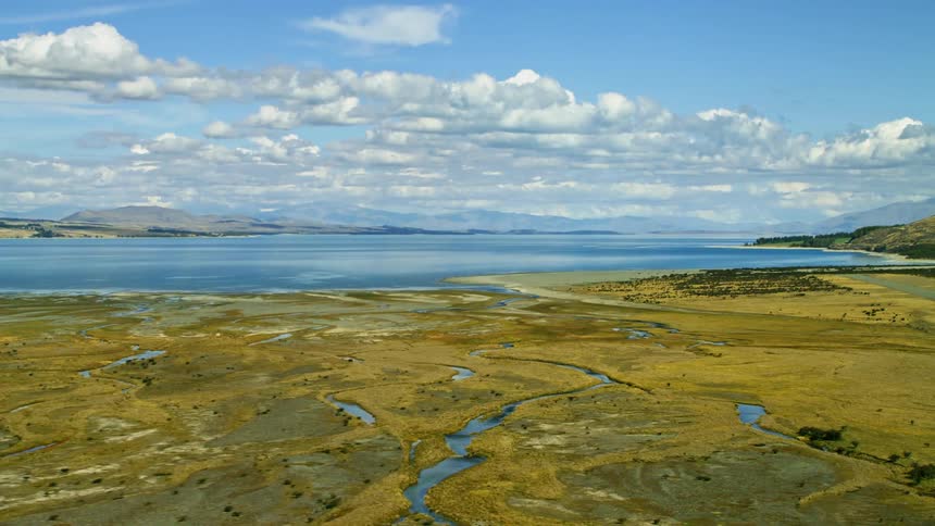 The alpine streams leads to the blue lake