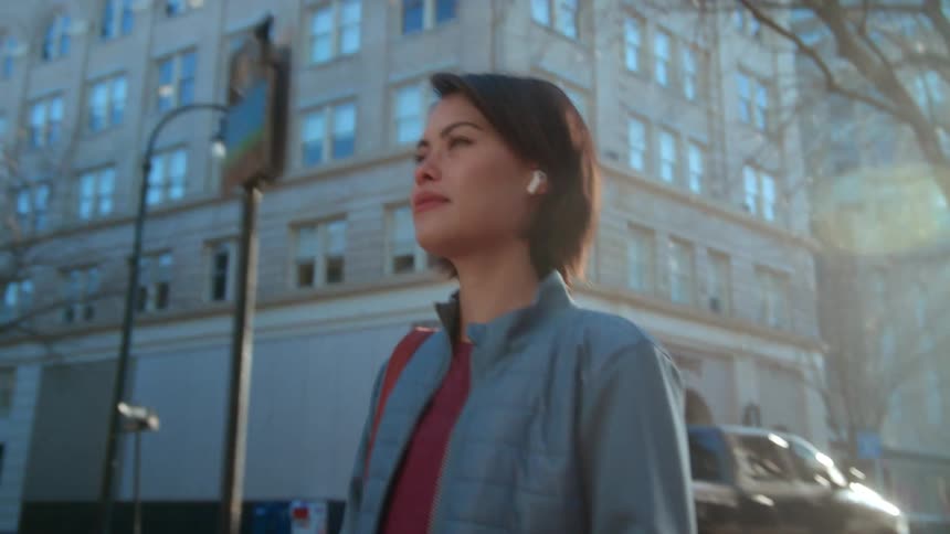 A woman is walking in the city