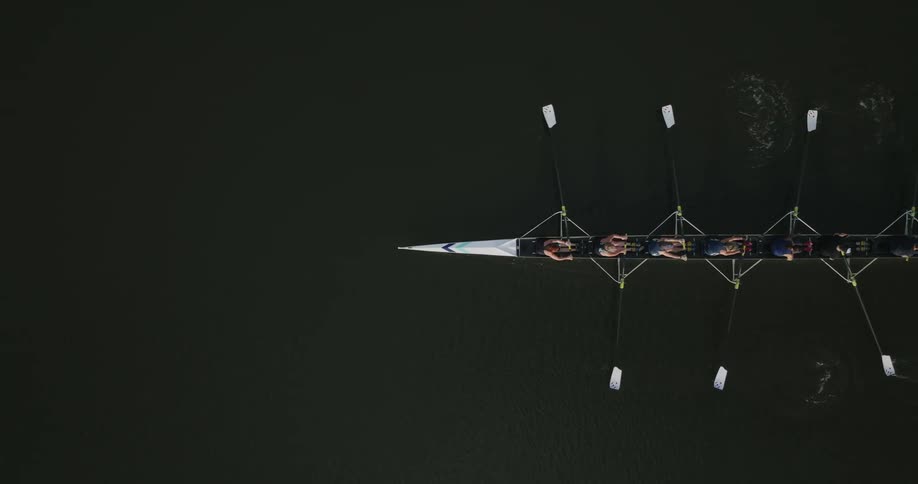A birds eye view of people rowing a boat