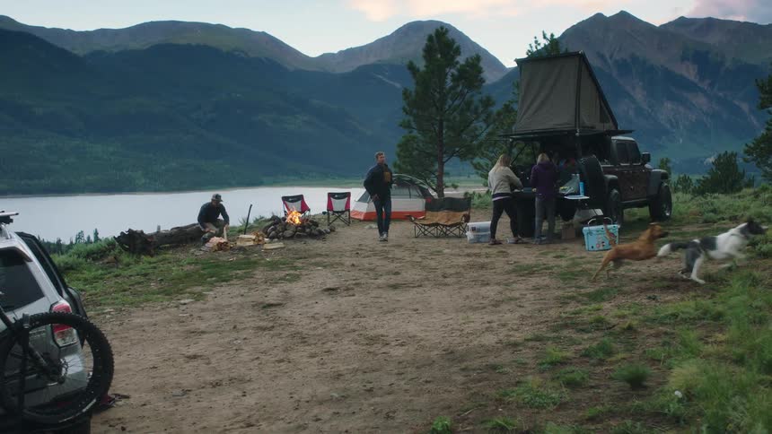A group of people are camping outdoors together