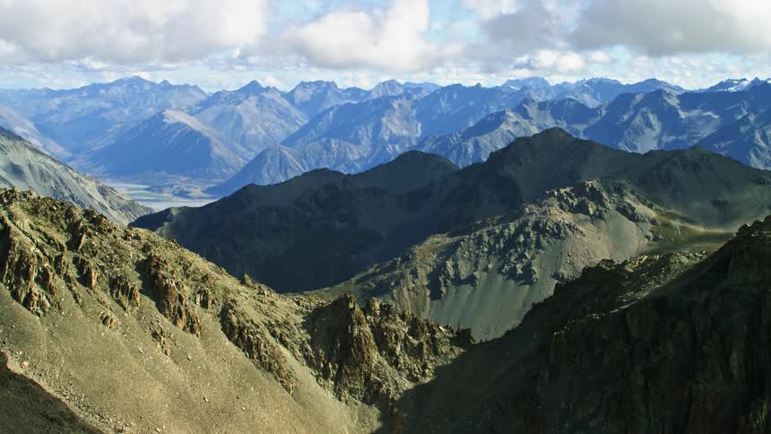An aerial view of a mountain range in the wilderness