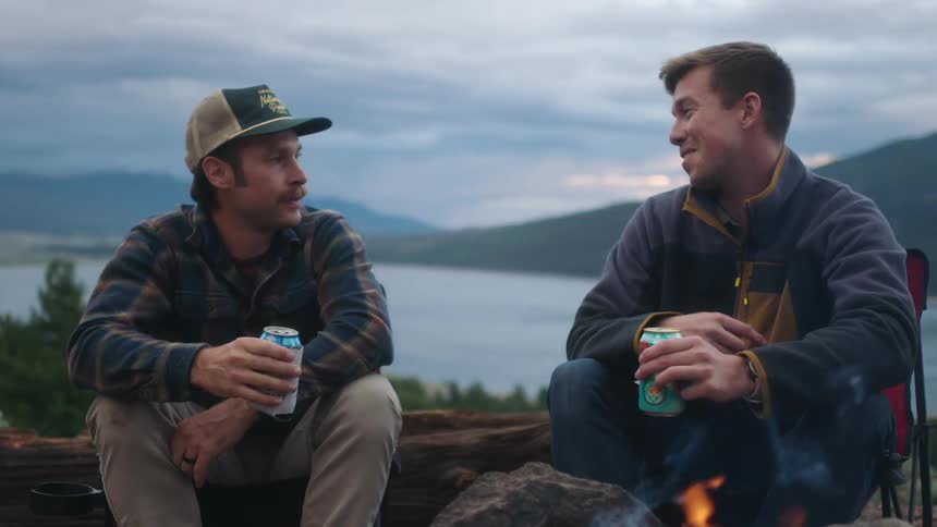 Two people camping outdoors