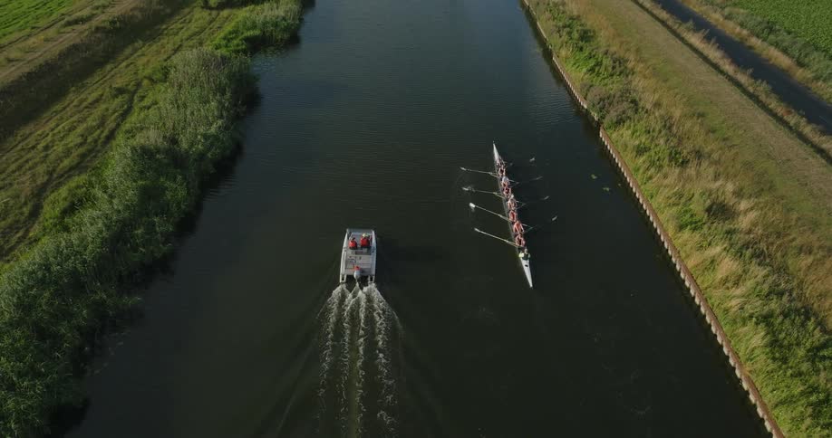 A group of people rowing down a river