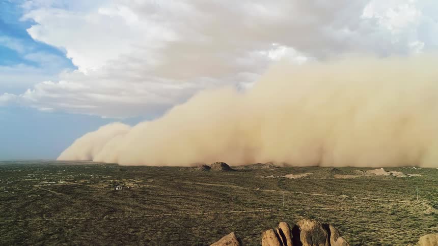 An intense dust storm carried across the desert and mountains