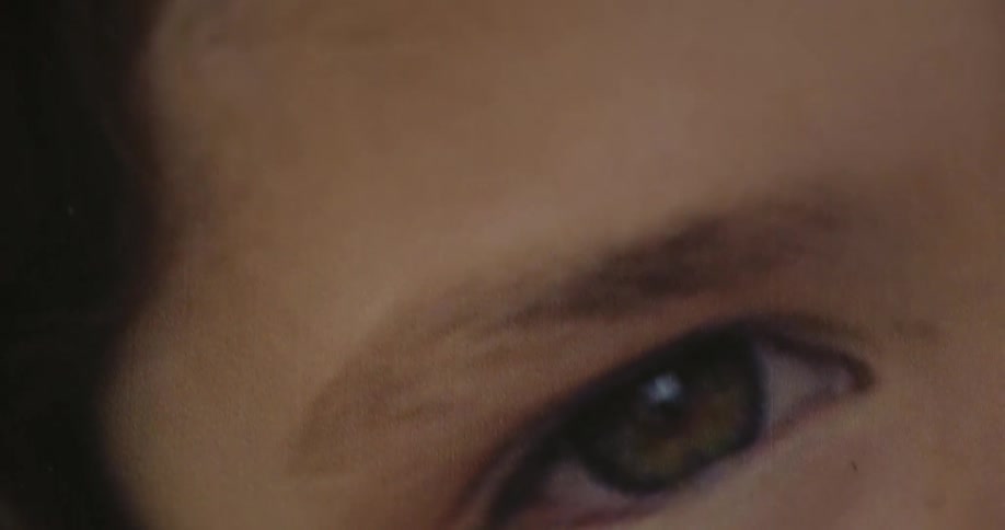 Extreme close up of the picture of a girl printed on paper
