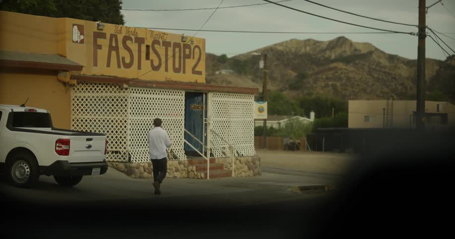 A man runs over to enter the shop
