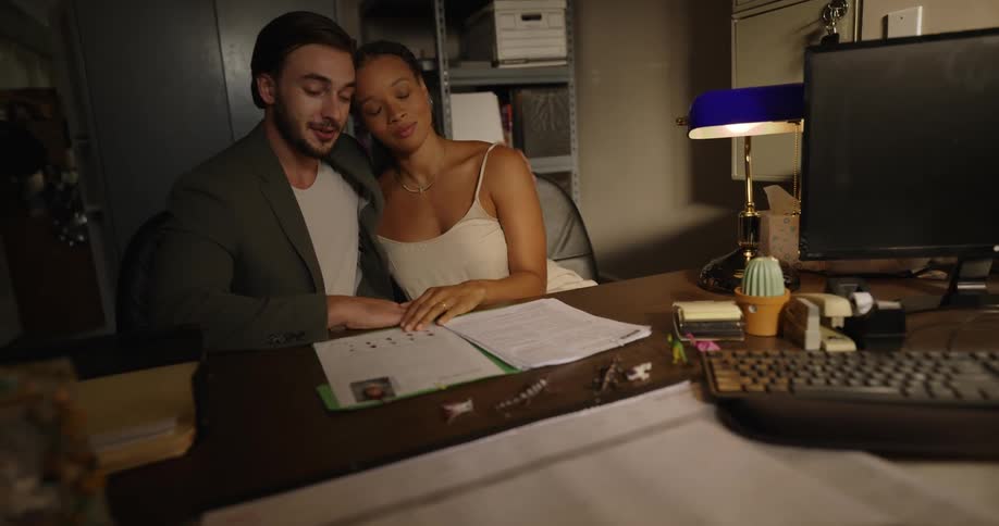 A couple look over paperwork in the office